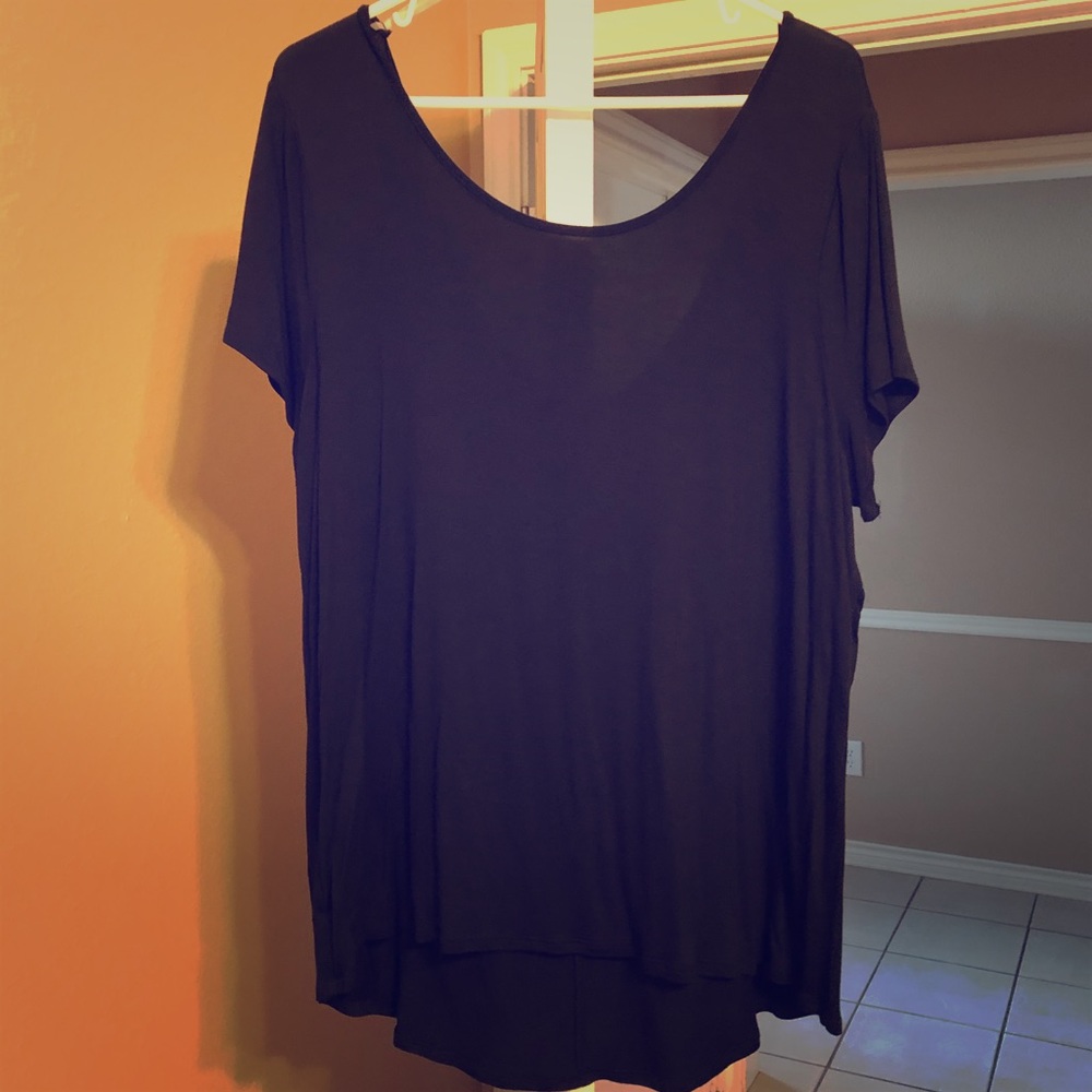 Loose fitting top with bow on back